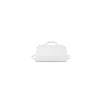 A white butter dish with a handle on top.